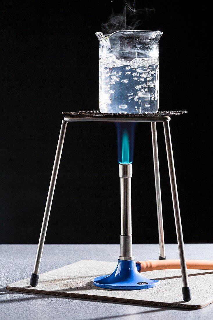 Boiling water with a Bunsen burner.