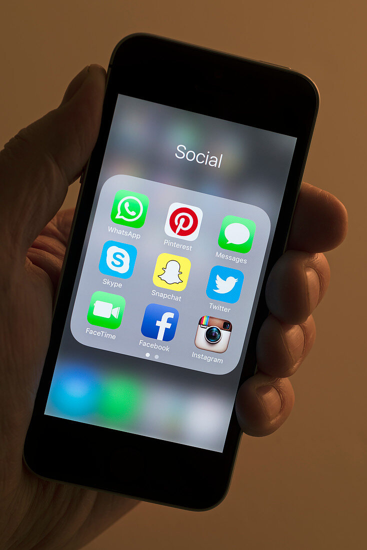 Social media app icons on smartphone
