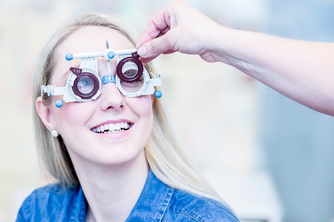 Optometrist examining woman's vision