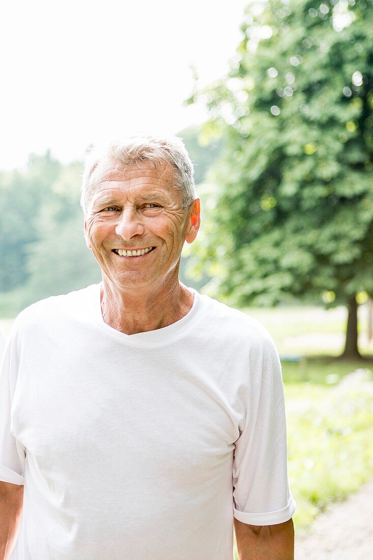 Man in white t-shirt smiling