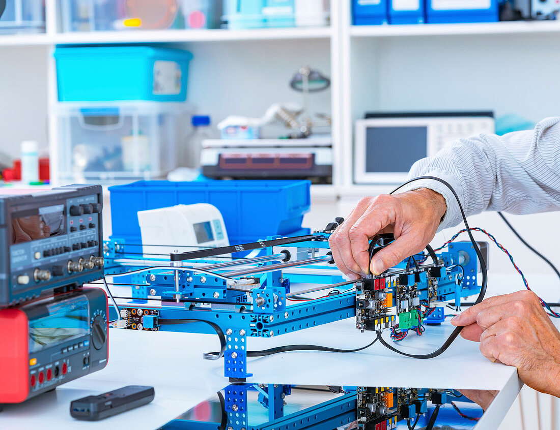 Person working in electronics laboratory