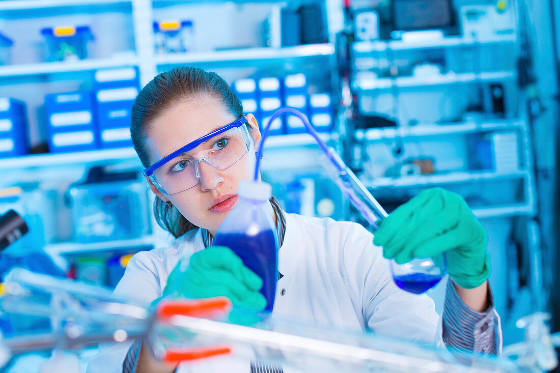 Scientist using laboratory equipment
