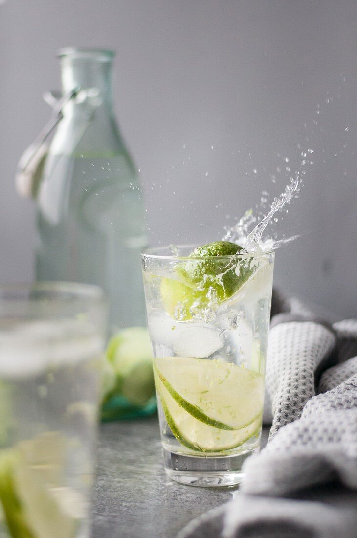 Water with lime and ice cubes