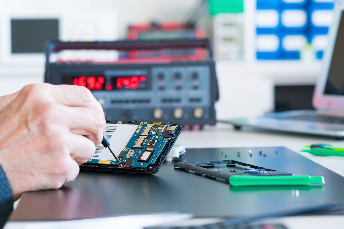 Person working on an electronic component