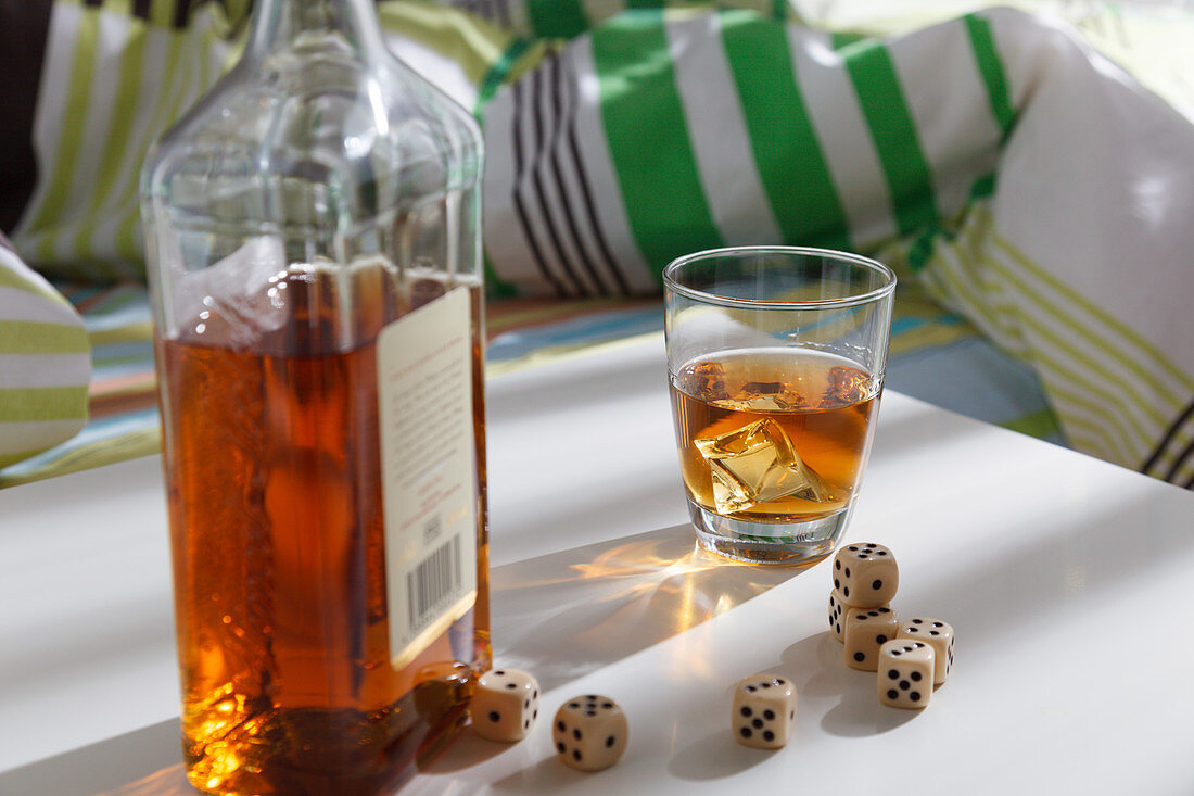 Whiskey bottle with dice
