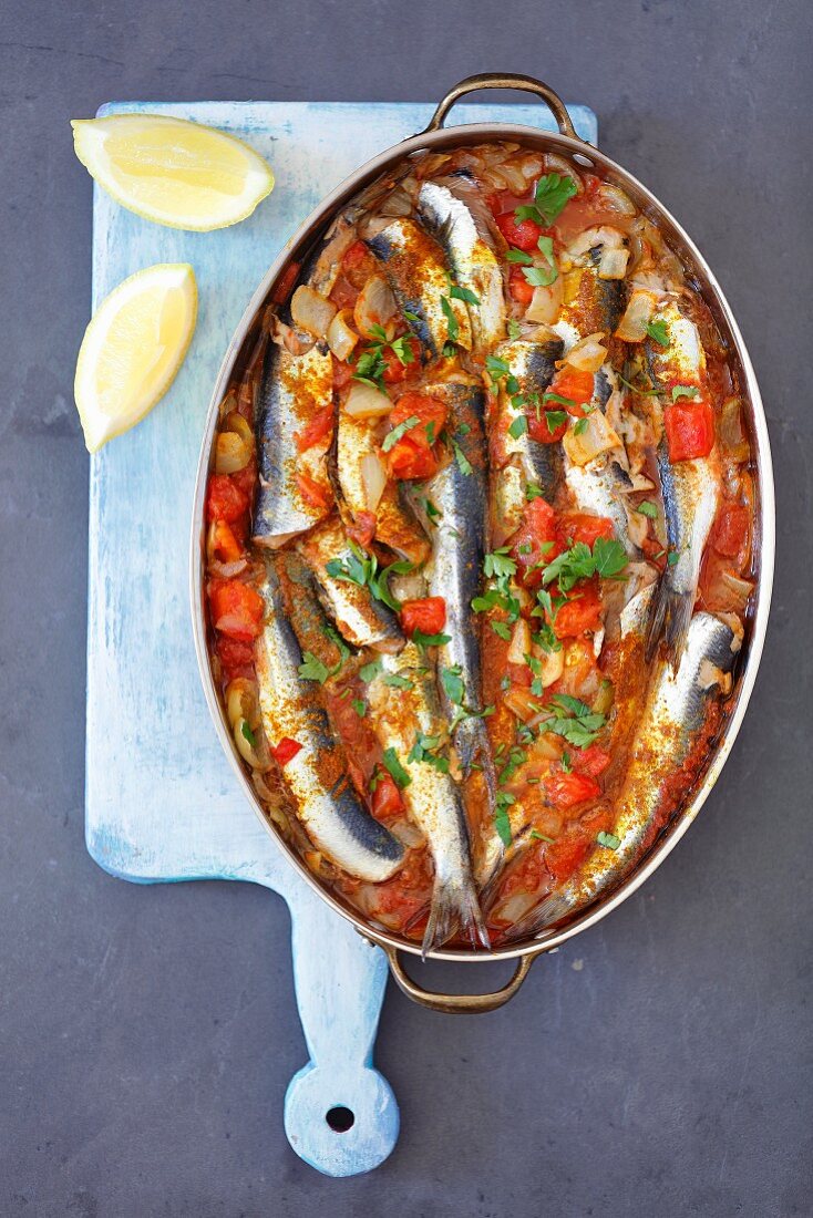Baked herrings with tomato sauce and curry