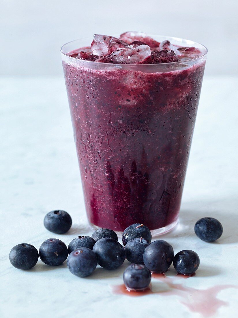 Blueberry and raspberry lemonade with ice cubes