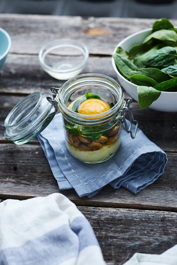 An egg in a glass: layered ingredients in a flip-top glass jar