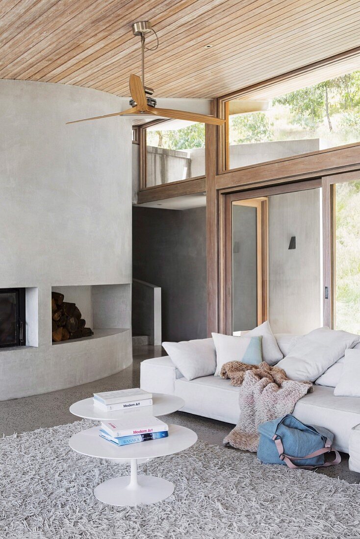 Modern living room in shades of gray with a glass front