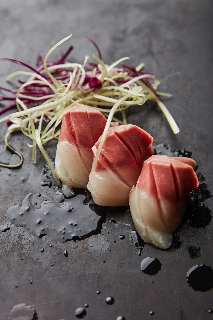 Three sashimis with vegetable strips