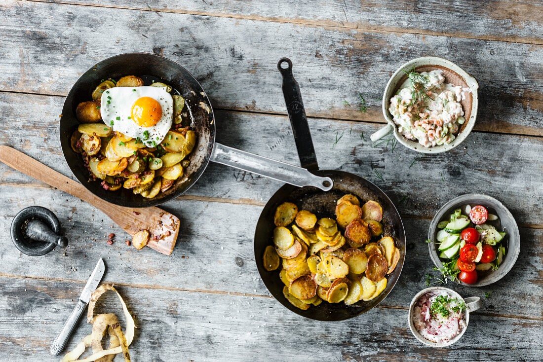 Colourful fried potato dishes (classic fried potatoes, radish quark, herb cream and marinated crab, and fried potatoes with a fried egg)
