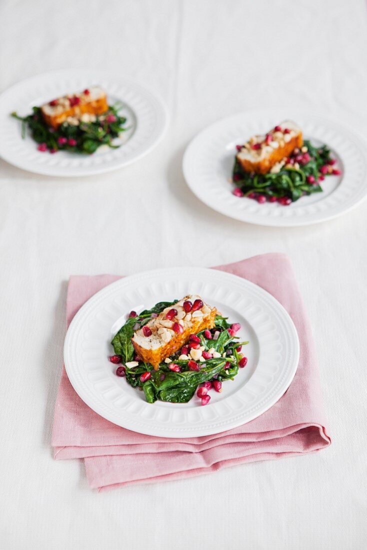 Halloumi with spinach and pomegranate seeds