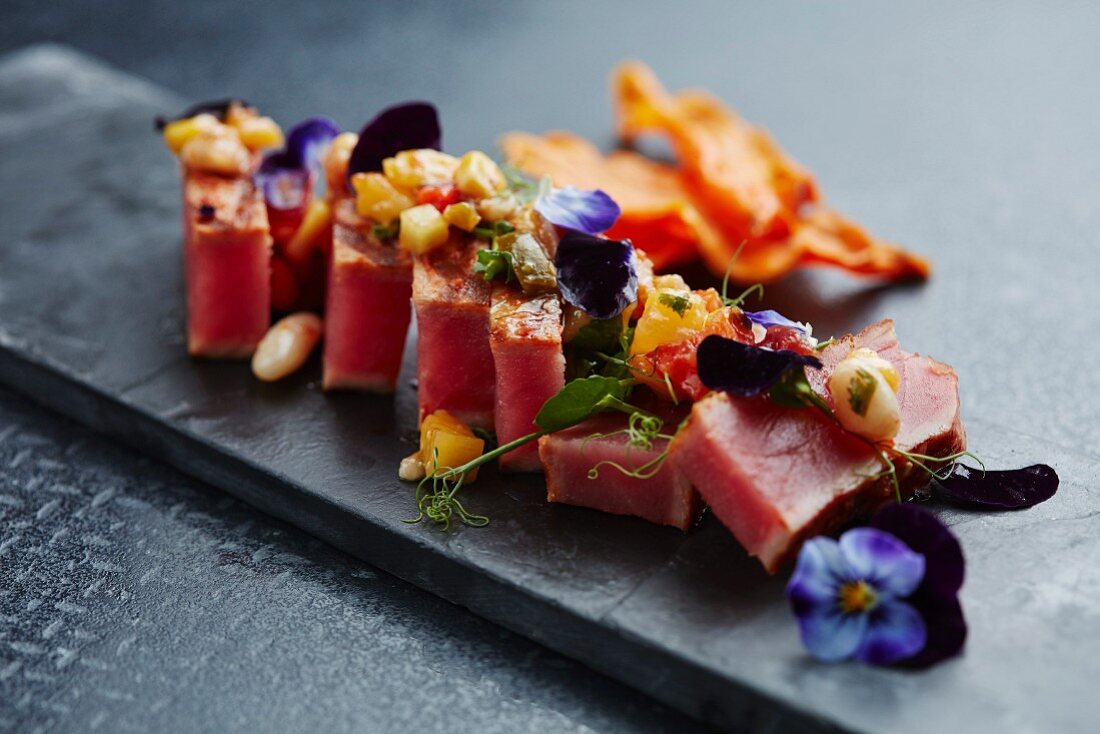 Flash fried tuna on salsa with vegetable crisps