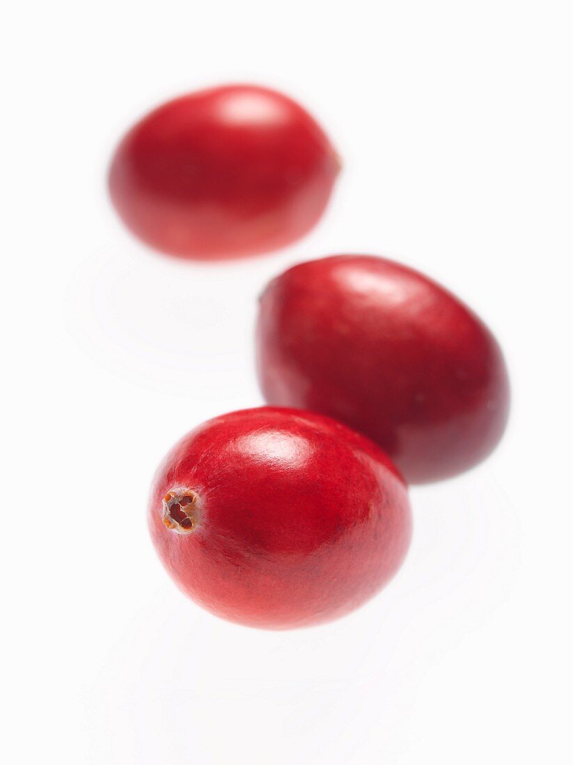 Three fresh cranberries