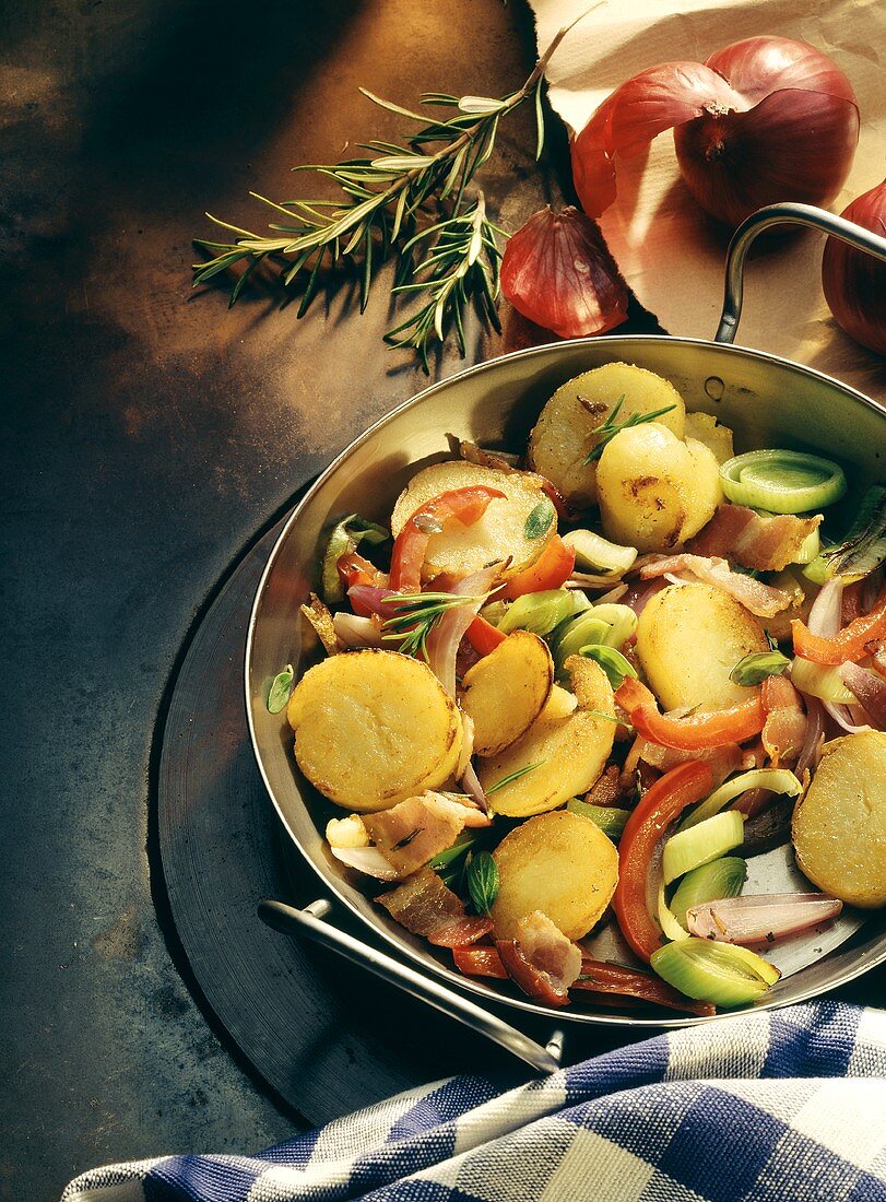 Potato dish with peppers, red onions, leeks, rosemary
