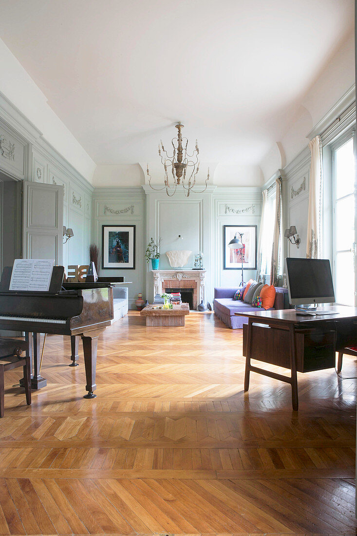 Large living room in period building with parquet floor and panelled walls