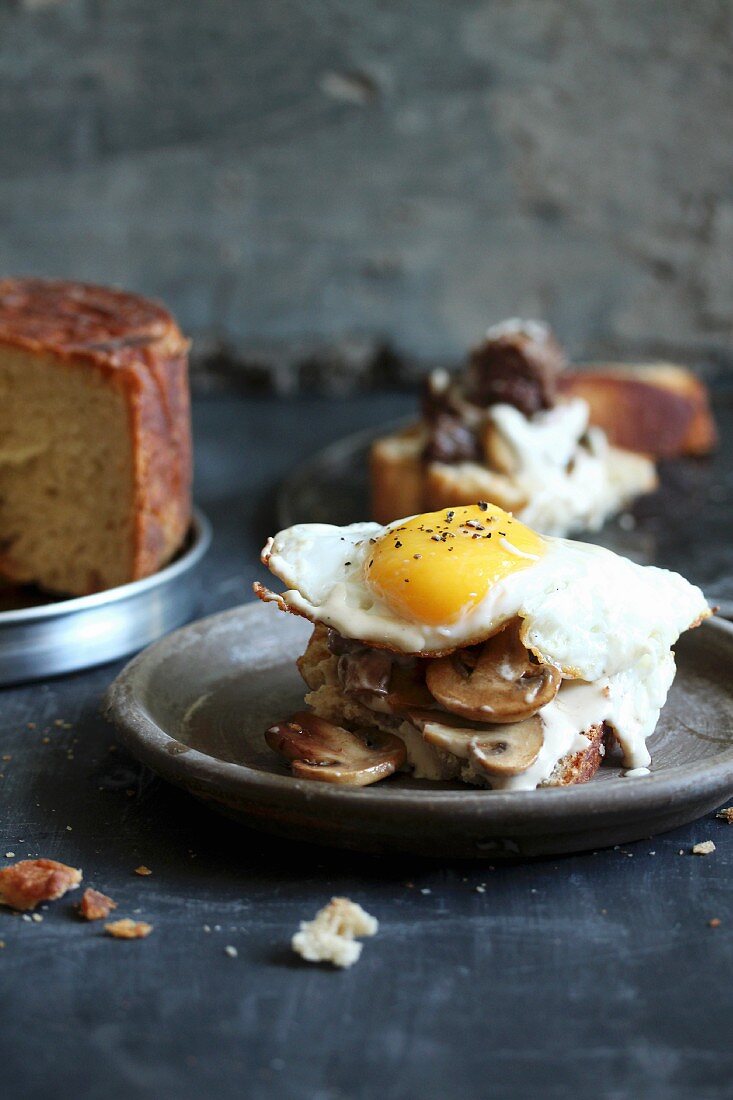 Yeast cake with mushrooms and fried eggs