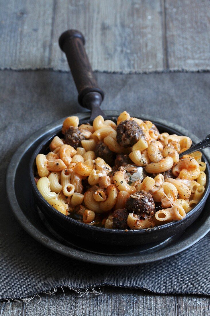 Macaroni with cheese and meatballs