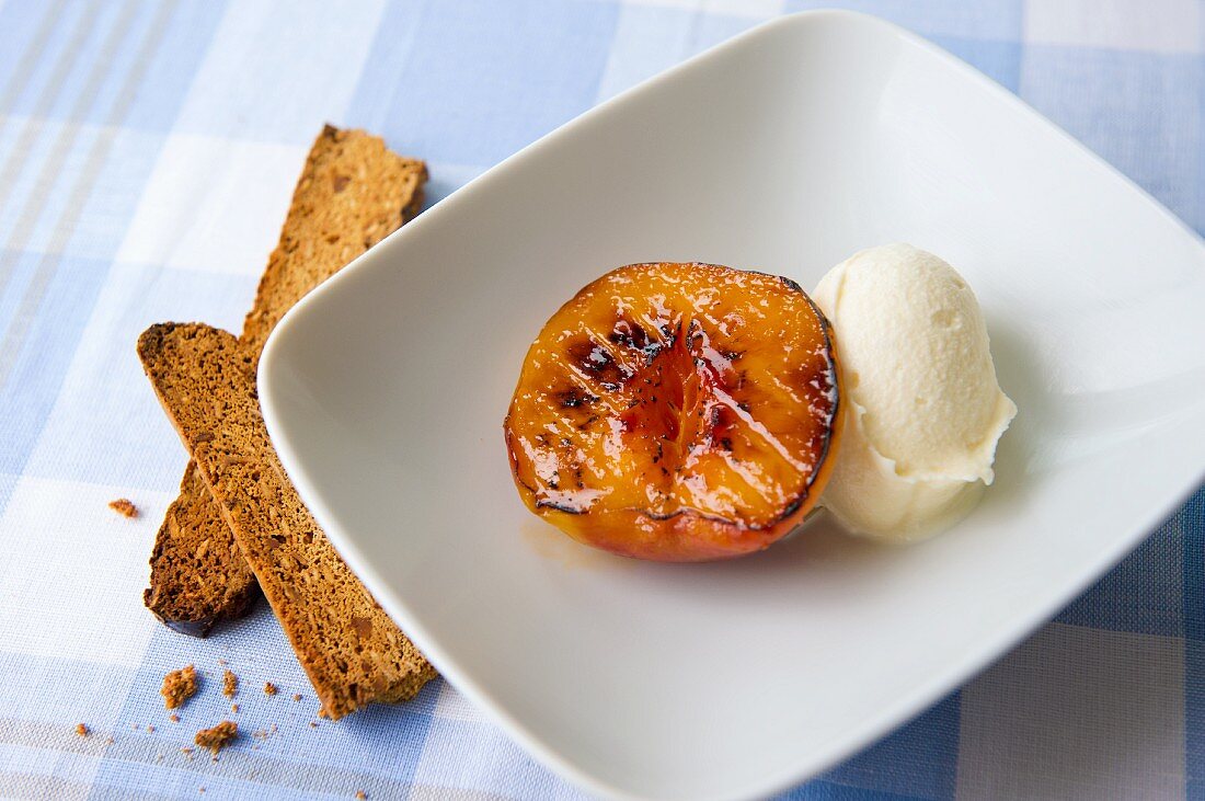 Grilled peach with vanilla ice cream