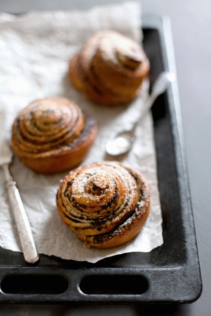 Homemade buns with poppy seeds and sugar in a pan