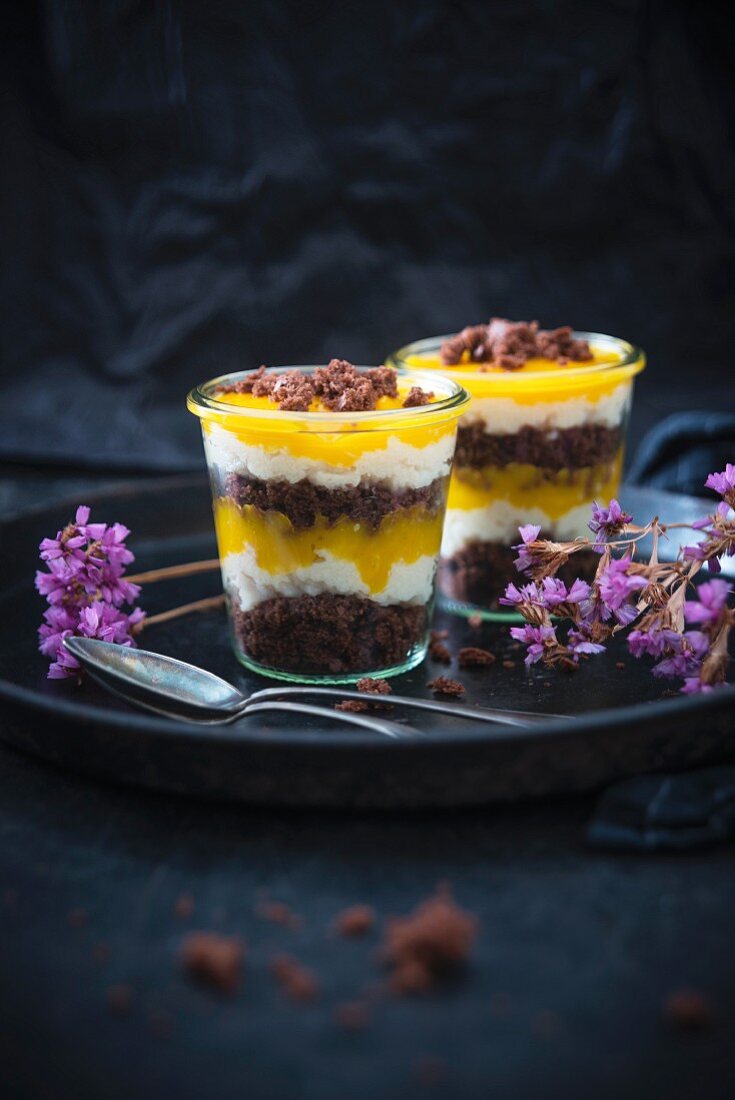 Vegan desserts made with chocolate cake, vanilla semolina cream, and mango purée
