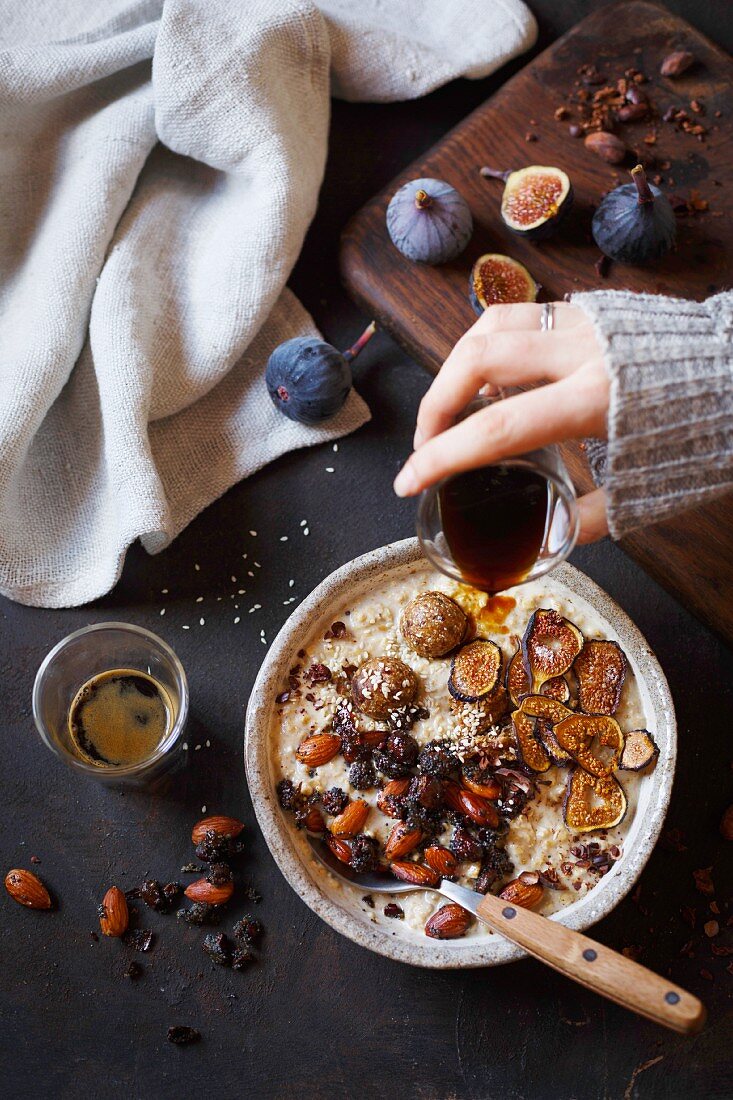A date smoothie bowl with oatmeal and cocoa nibs