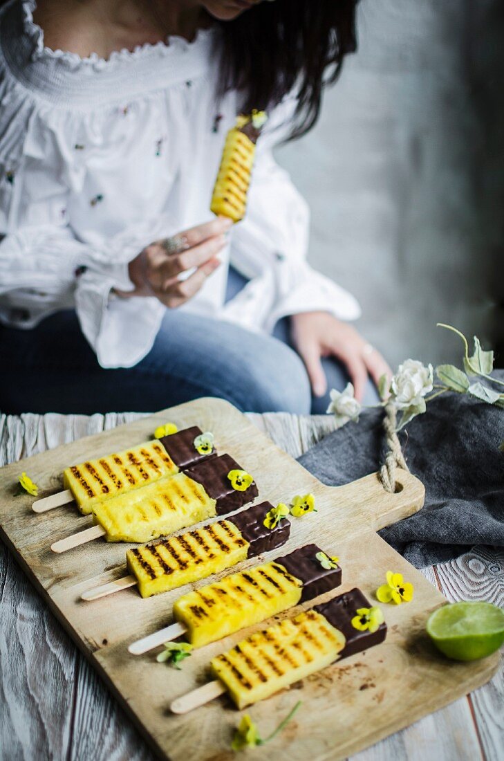 Charred pineaplle sticks sipped in dark chocolate