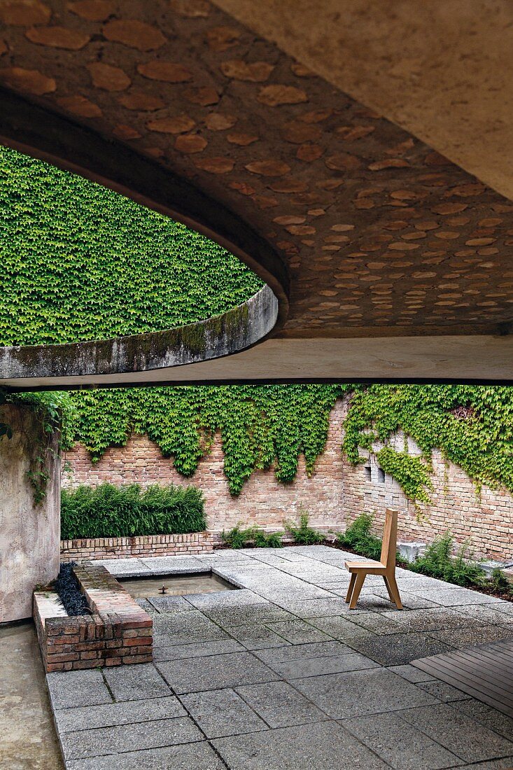 Sculpture garden with a round cutout roof on the Biennale grounds in Venice, Italy