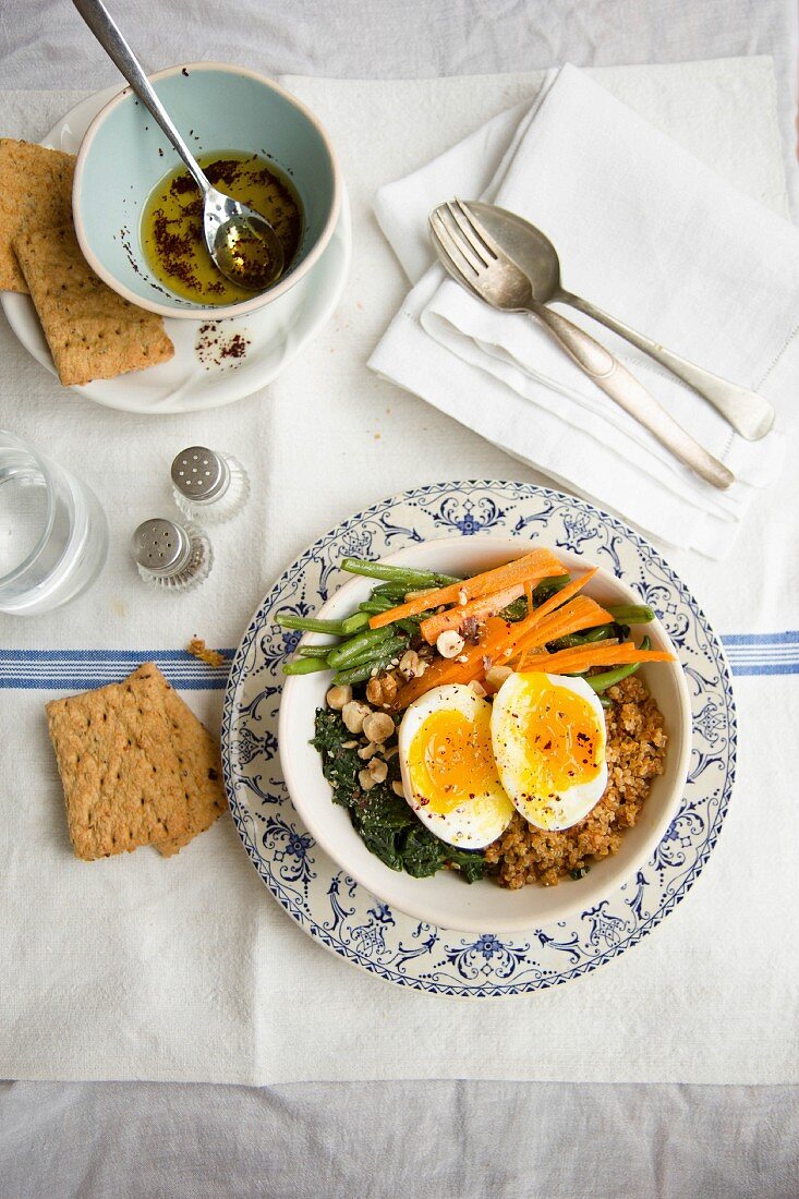 Quinoa salad with vegetables, egg, and zatar vinaigrette (top view)