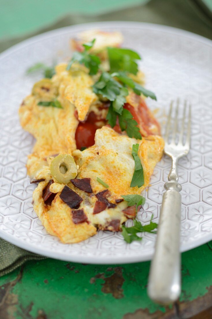 An omelette with olives and bacon
