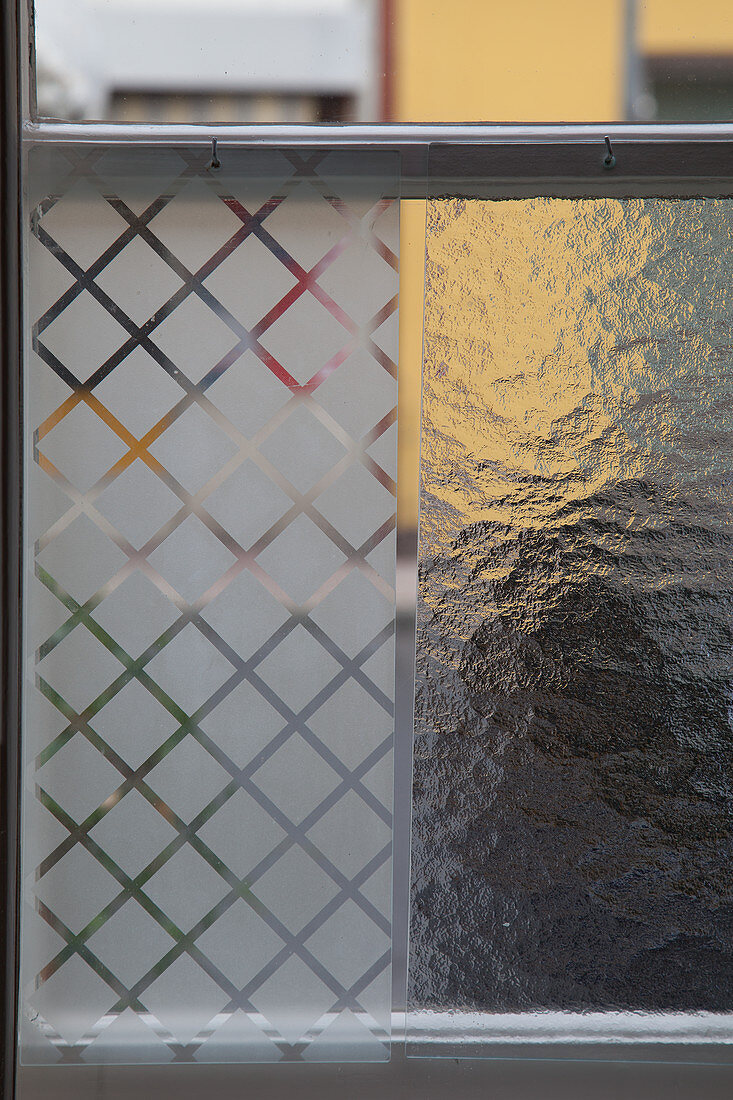 Two different privacy films on lattice window