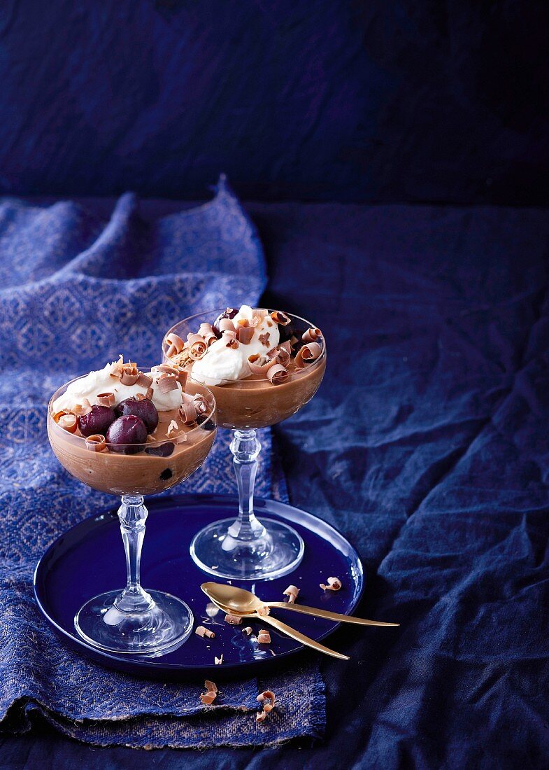 Chocolate tiramisu with pickled cherries in dessert glasses