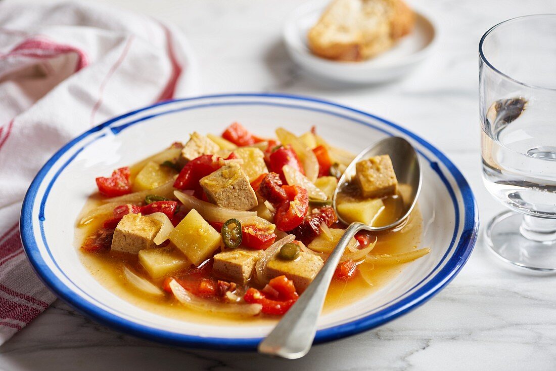 Tofu goulash with peppers, potatoes, dried tomatoes, onions and chillies (vegan)