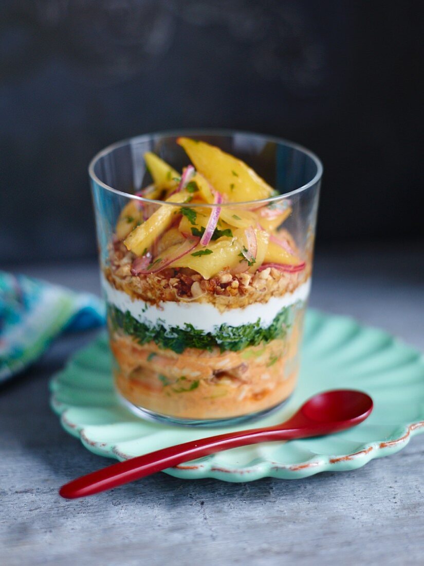 Thai curry trifle with chicken and mango in a glass