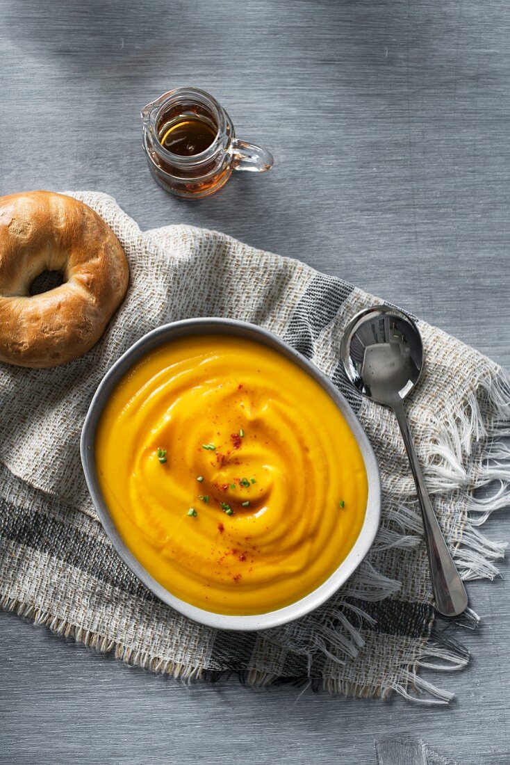 Orange and sweet potato soup with maple syrup