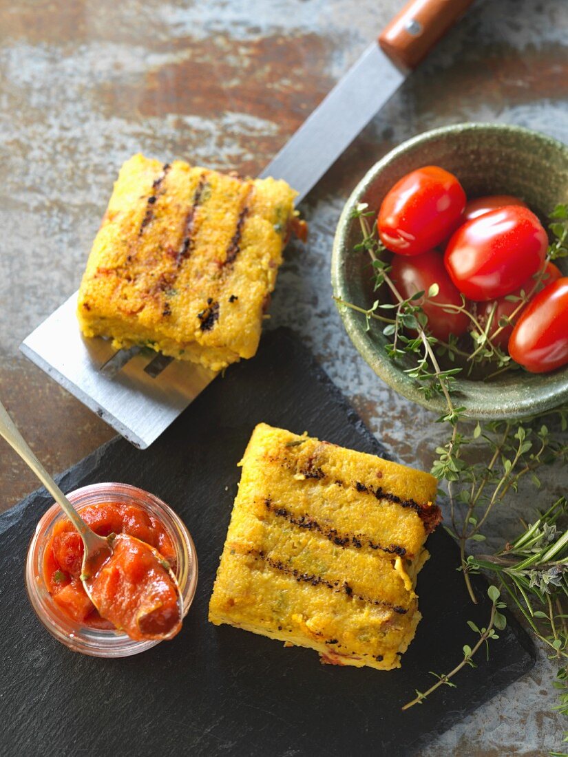 Grilled polenta slices with tomato salsa