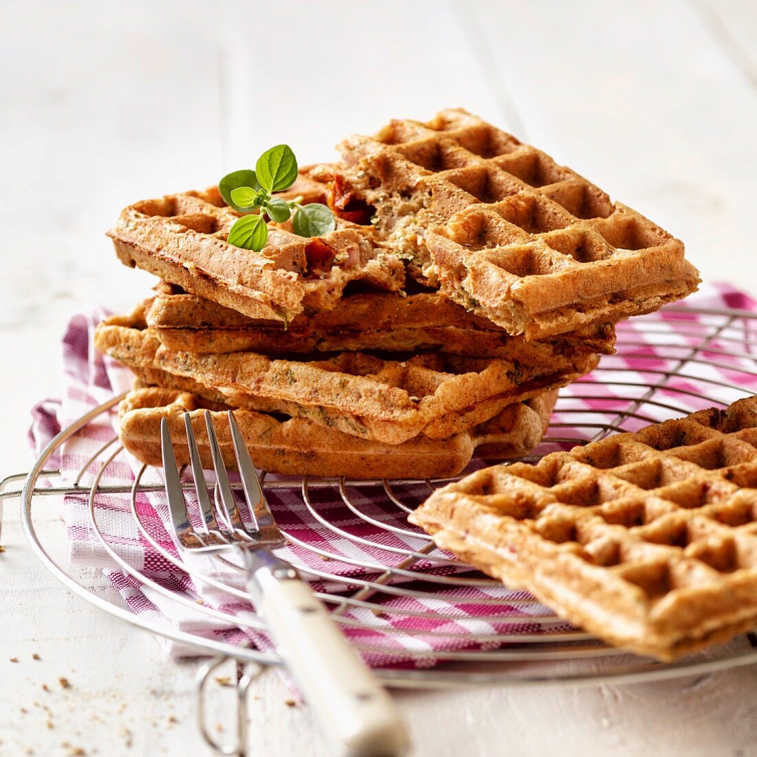 Pizza waffles with ham and dried tomatoes