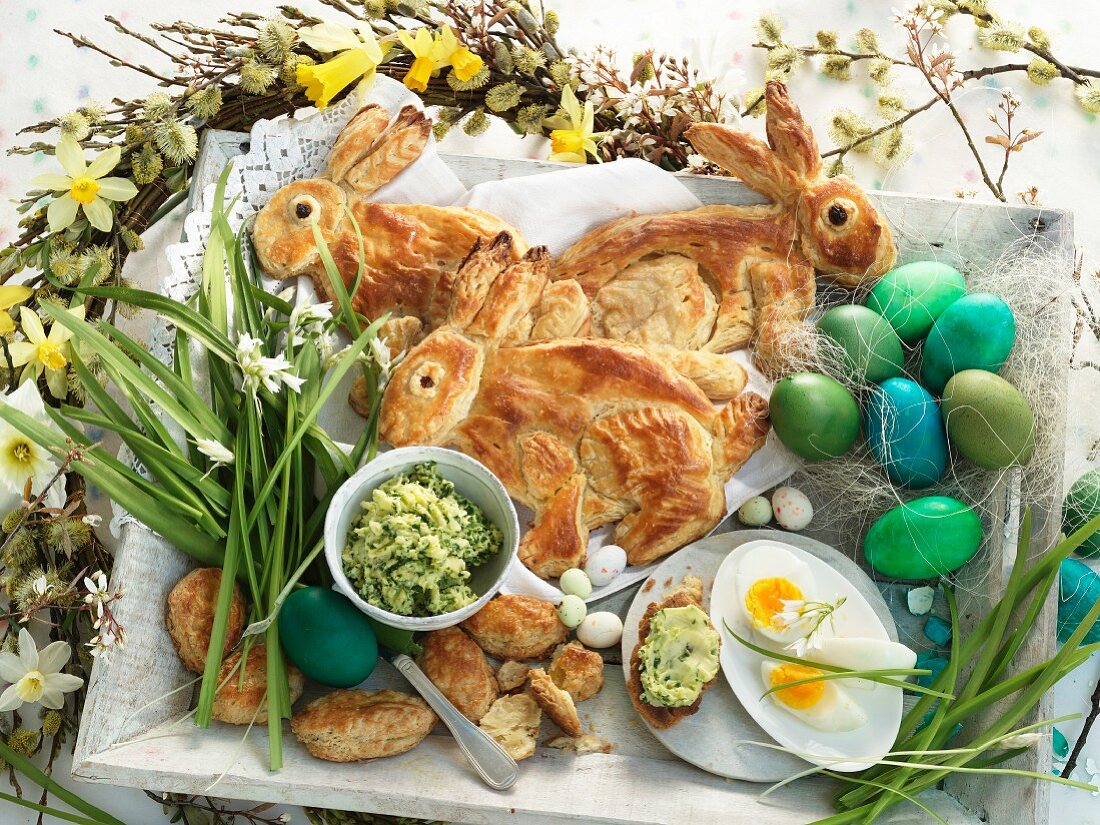 Puff pastry Easter bunnies, dyed eggs, chocolate eggs, herb butter, and toast