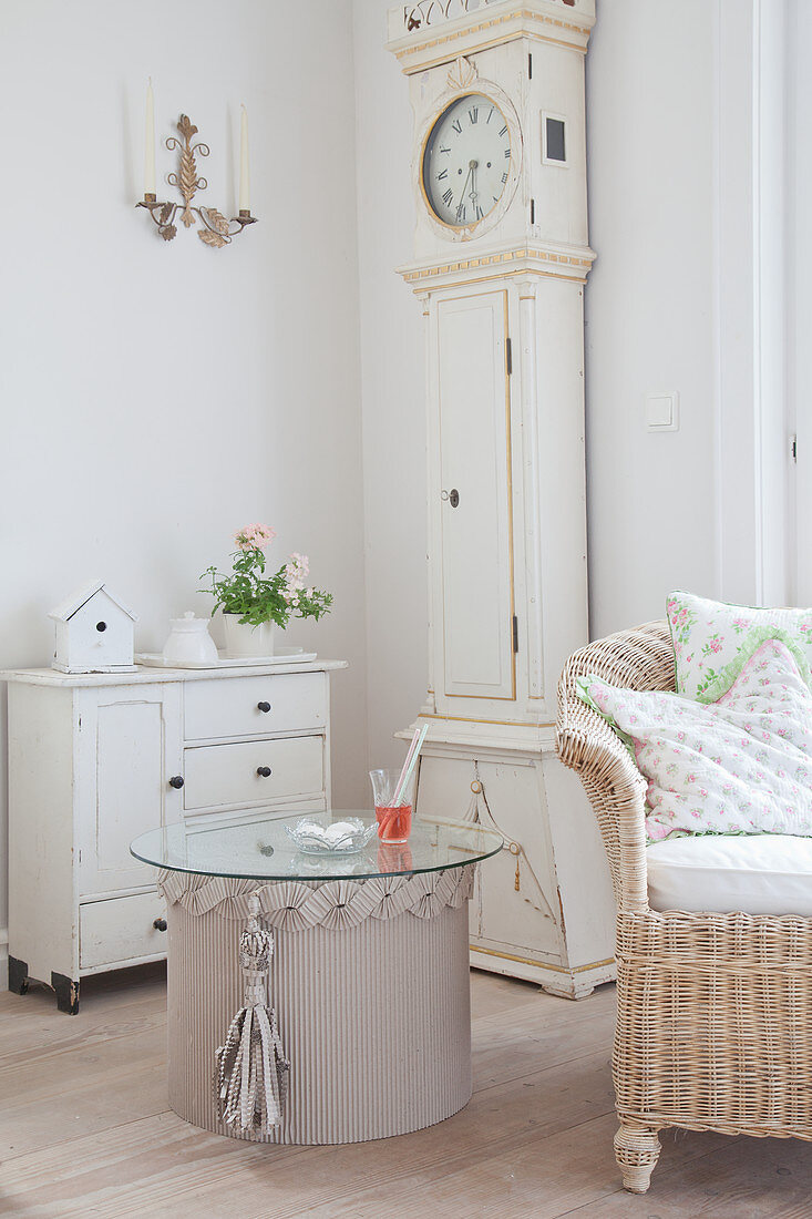 Side table made from corrugated cardboard with glass top in living room