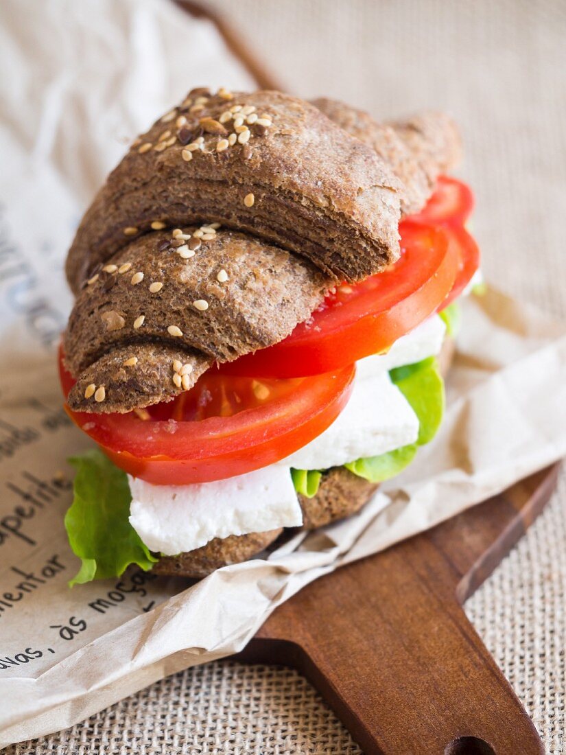 Vegetarian cheese and vegetable sandwich on an whole grain croissant