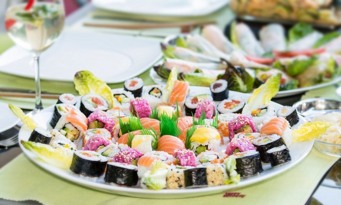 Various types of sushi on a round serving platter (Japan)