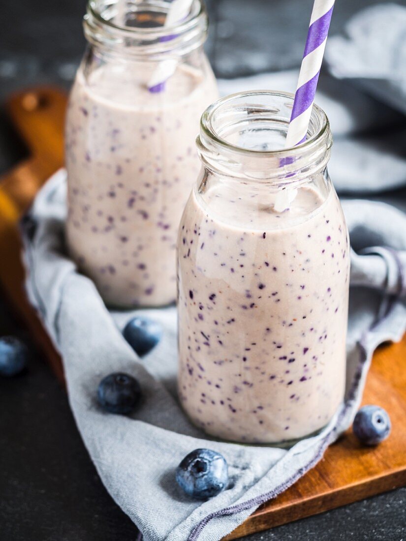 Vegan blueberry smoothie in small bottles