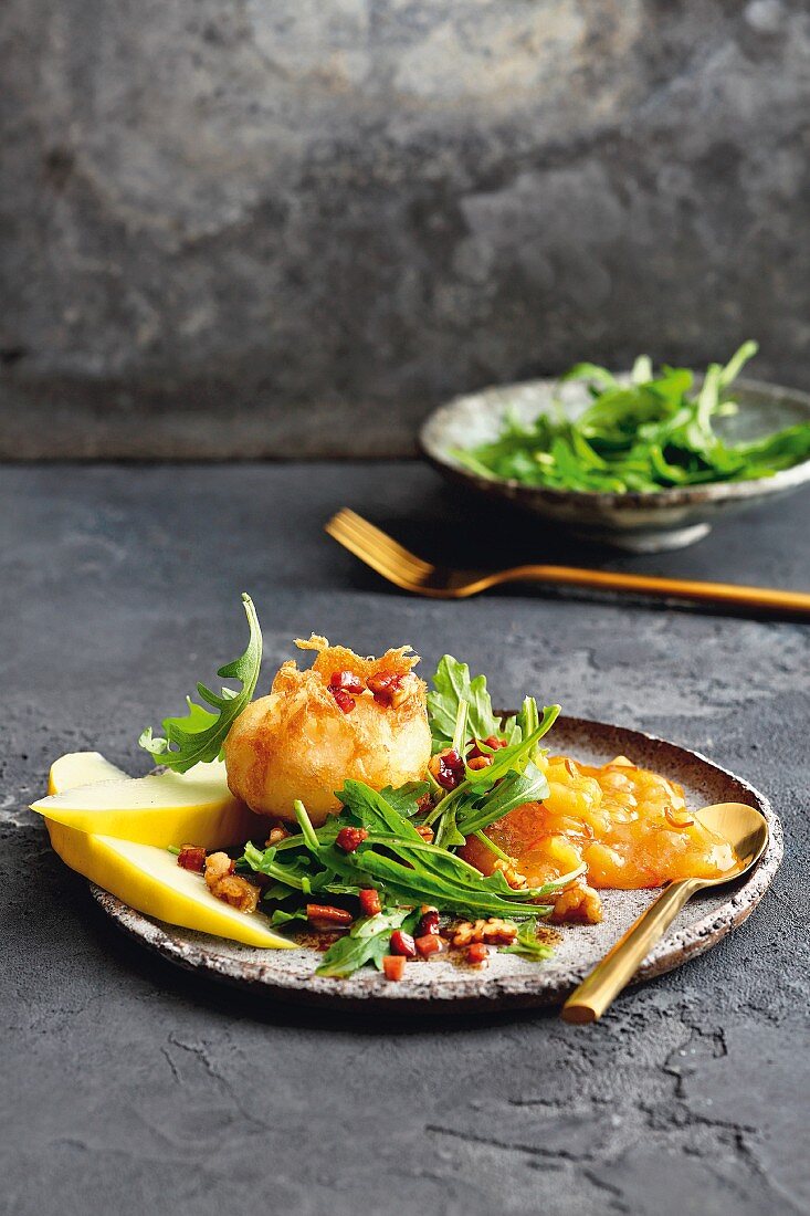 Honeydew melon and chilli marmalade with oven-baked goat's cheese, rocket and pecan nut and bacon vinaigrette