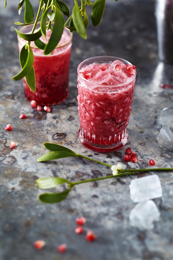 Pomegranate and coconut cocktails with ice cubes
