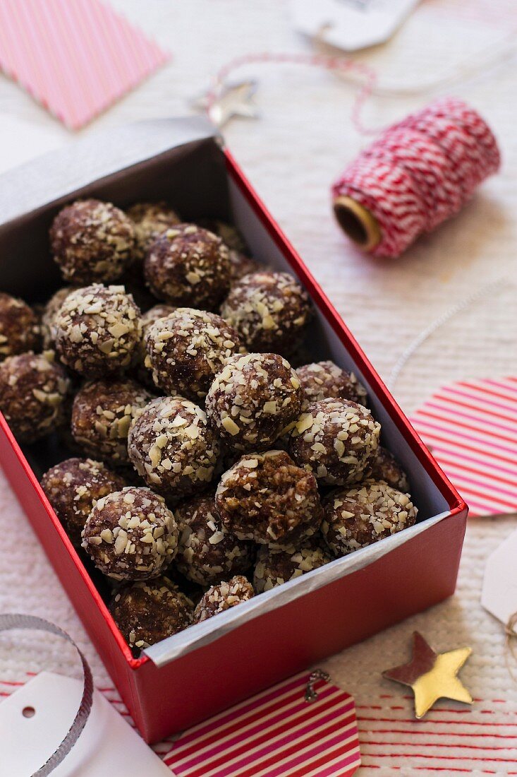 Dates and almond truffles, no sugar, cup of coffee, Christmas decorations