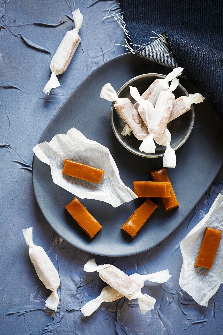 Toffees, partially wrapped in paper