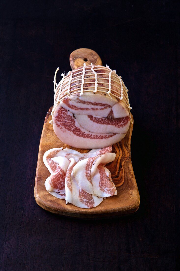 Guanciale (pork bacon from Lazio, Italy) on a wooden board