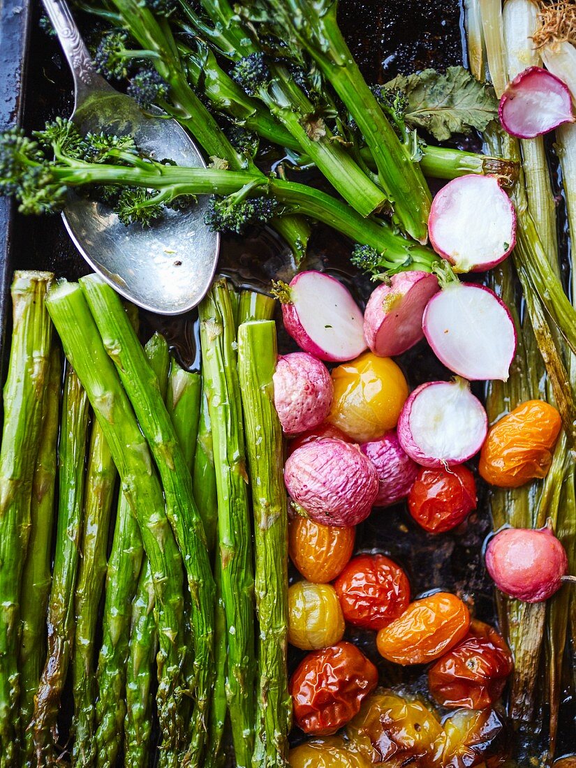 Roasted vegetables, radishes, broccoli, spring onions, asparagus and tomatoes