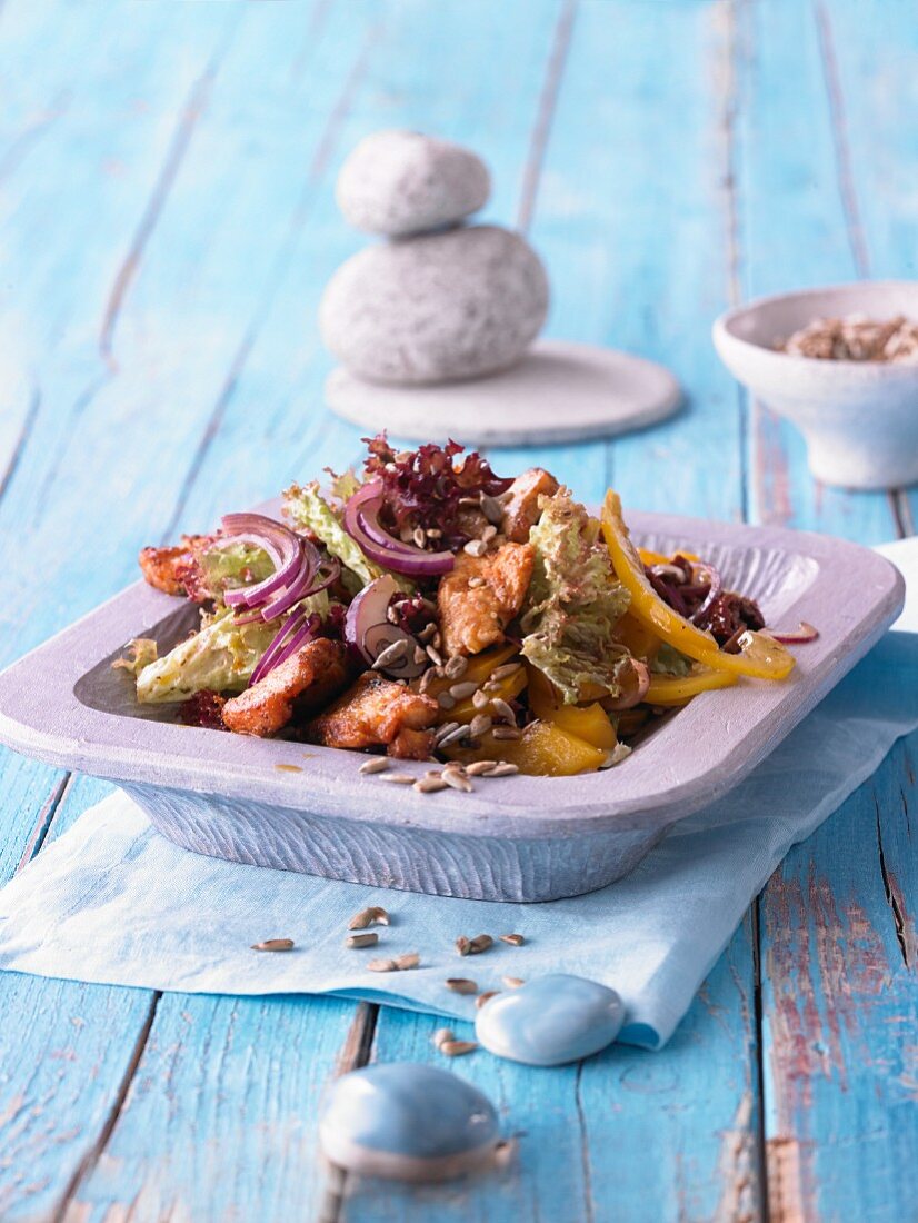 Little princess salad with chicken breast, dried tomatoes and spicy fruit dressing