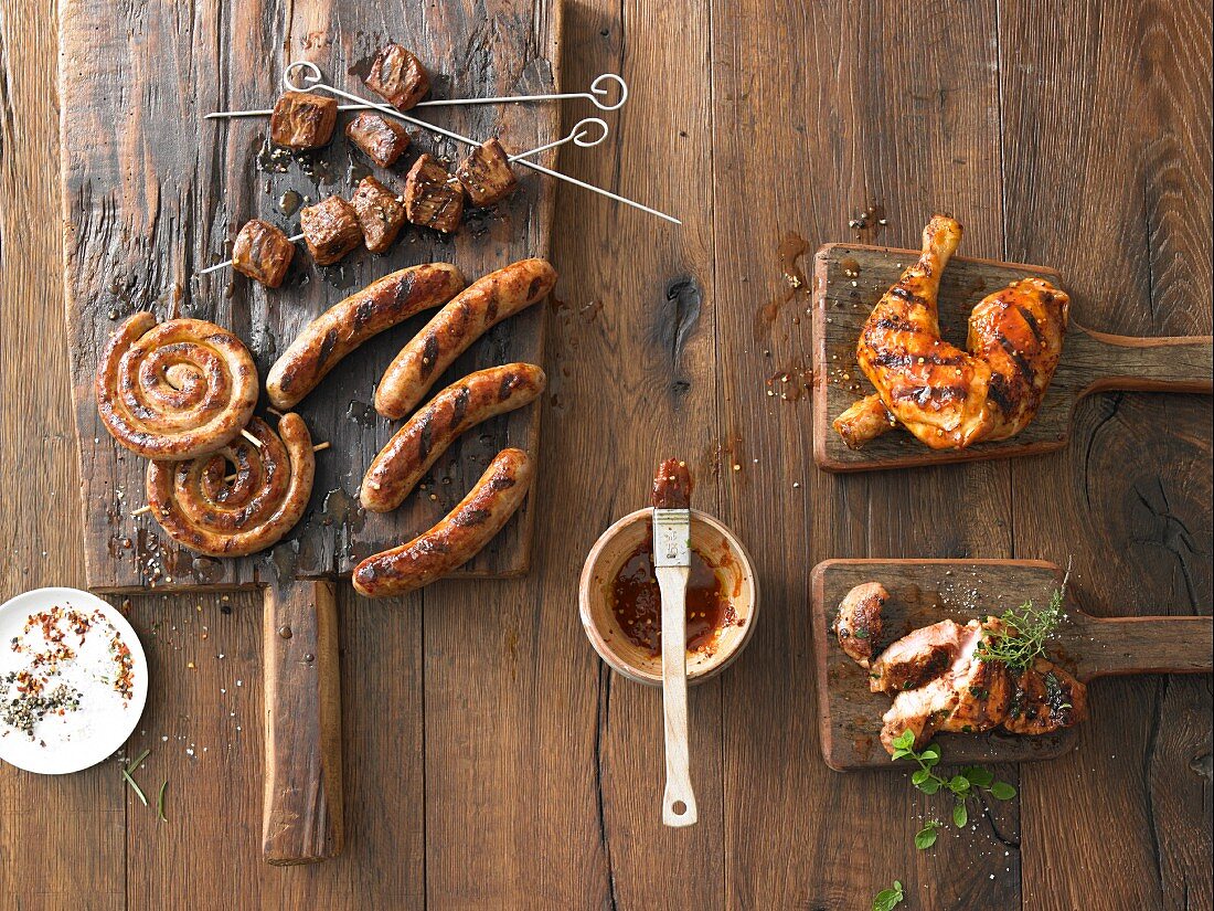 Grilled sausages, grilled meat skewers, and grilled chicken